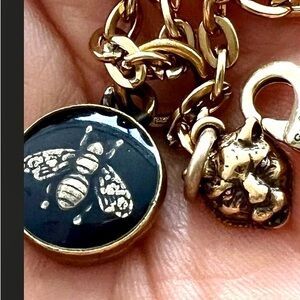 Gucci Gold and Black Bee Necklace and the leopard head also on necklace